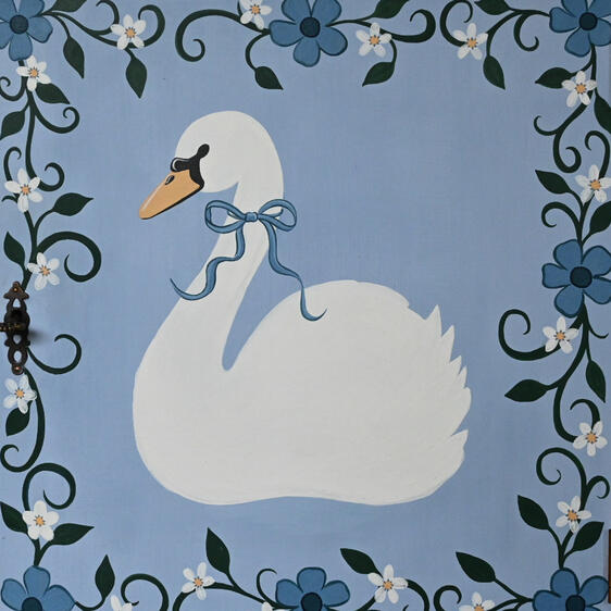 Swan illustration “Hand-painted blue wooden cabinet with swan design, floral detailing, vintage style bedside table or storage cupboard, unique upcycled furniture.”