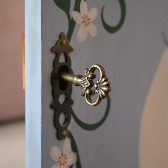 Vintage key Close up of lockable cupboard door