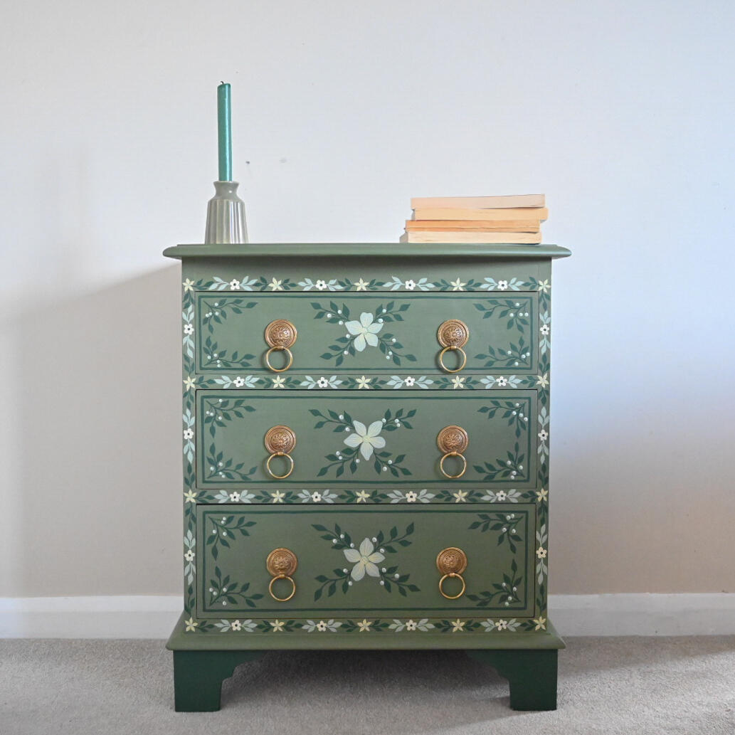 Green floral chest of draws Painted green three drawer floral chest with brass handles