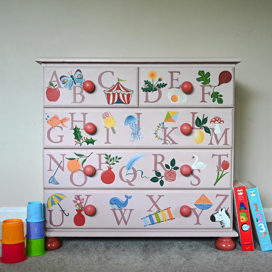 Hand painted illustrated alphabet chest of drawers “Hand-painted blue wooden cabinet with swan design, floral detailing, vintage style bedside table or storage cupboard, unique upcycled furniture.”